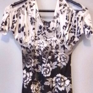 This is a dots medium white to black shirt that flares out at the bottom.